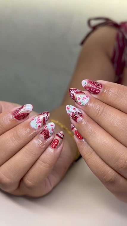 Red and white floral set at Reborn Nails & Retreat Da Nang
